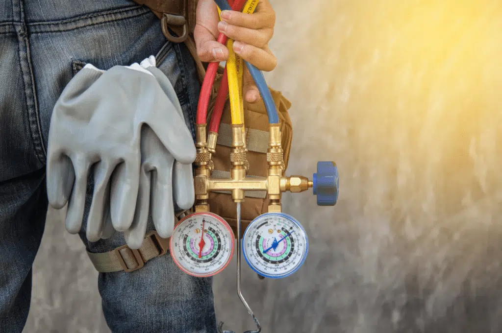 technician grabbing a gauge