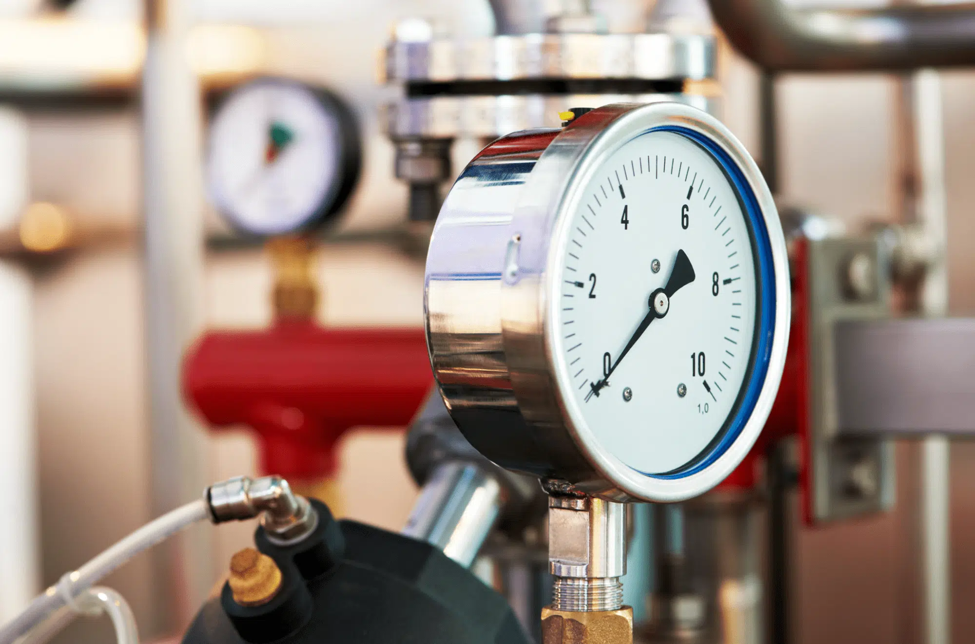 Boiler room thermometer displaying precise temperature readings in an industrial boiler room