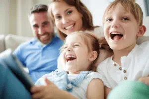 family laughing in living room