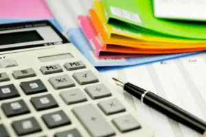 calculator with bright folders for doing bills